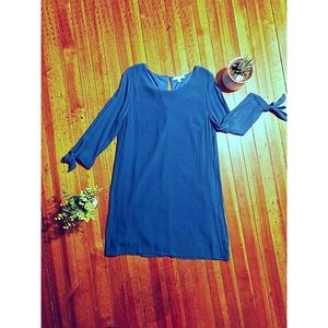 Blue shift dress with bow-tie cuff detail